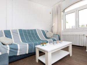 A seating area at Holiday Home Platja by Interhome Még 22 kép