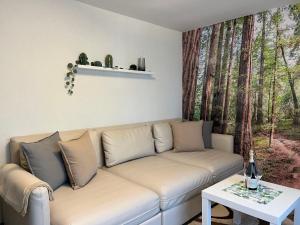 a living room with a couch and a table at Apartment Hartmann by Interhome in Laudenau