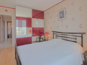 a bedroom with a white bed in a room at Apartment L'Escale Vendée Globe - LSD300 by Interhome in Les Sables-dʼOlonne +17 photos