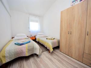 Postel nebo postele na pokoji v ubytování Holiday Home Queen Ahn by Interhome