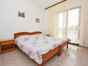 Postel nebo postele na pokoji v ubytování Apartment Vesela-4 by Interhome