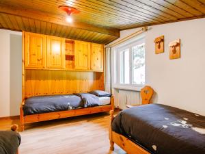 A bed or beds in a room at Apartment Mantina-2 by Interhome