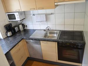 Kuchyňa alebo kuchynka v ubytovaní Apartment Apart Garni Wachter-1 by Interhome