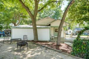 a house with a picnic table and two trees at New Braunfels Vacation Rental on Lake Dunlap! in New Braunfels