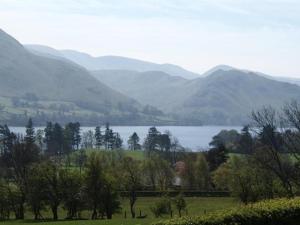a view of a lake with mountains in the background at Brackenrigg Inn in Watermillock