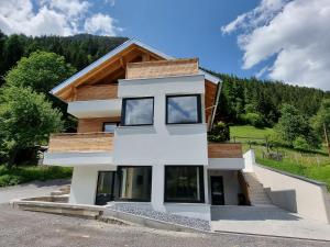 a house on the side of a mountain at Apartment Home Holzwurm by Interhome in See