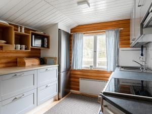 Kuchyň nebo kuchyňský kout v ubytování Holiday Home Wuorilahti by Interhome