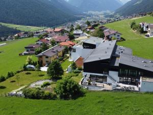 an aerial view of a small village in a green field at Apartment Oberhofer-5 by Interhome in Telfes im Stubai