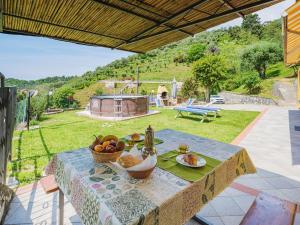 a table with a bowl of fruit on it at Holiday Home Bellavista by Interhome in Strettoia