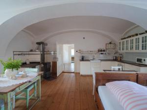 a kitchen and dining room with a table and a dining room at Holiday Home Kojetice na Moravě by Interhome in Kojetice