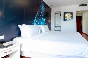 Postel nebo postele na pokoji v ubytování Hotel A.S. Lisboa