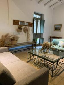 a living room with a couch and a coffee table at Casa de Piedra in La Cumbre