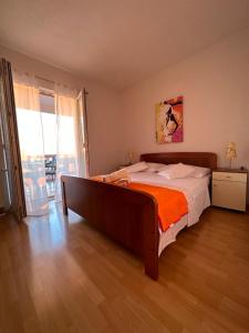 Ένα ή περισσότερα κρεβάτια σε δωμάτιο στο Marela Apartments