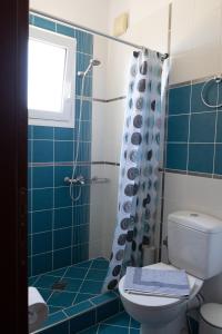 a bathroom with a toilet and a shower at John&Effie's Studio in Lygia +16 photos