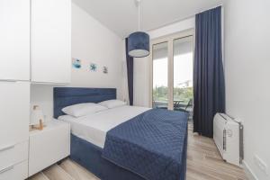 Postel nebo postele na pokoji v ubytování La barca apartments + 37 fotografií