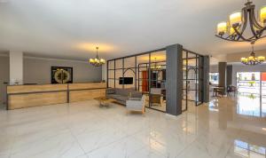 a living room with a couch and a table at Tangiers Hotel Ex Marina Bay in Bodrum City