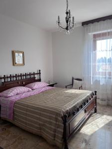 Posteľ alebo postele v izbe v ubytovaní Casa vacanze Giulianova Lido