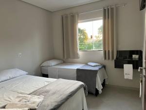 En eller flere senge i et værelse på Hotel San Lucas