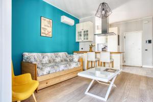 a living room with a couch and a table at ALTIDO Delightful flat with terrace in Milan