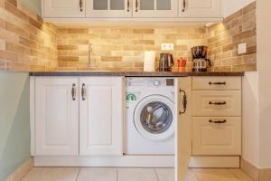 A kitchen or kitchenette at Cozy Corfiot house