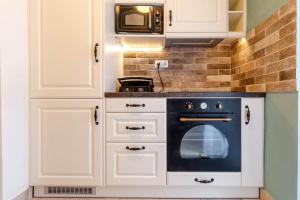 A kitchen or kitchenette at Cozy Corfiot house