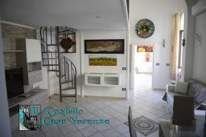 a living room with a staircase and a living room at Il Castello casa vacanza in Salerno