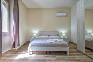 Posteľ alebo postele v izbe v ubytovaní Vico Rooms