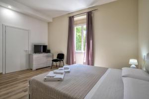 Posteľ alebo postele v izbe v ubytovaní Vico Rooms