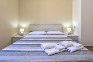Posteľ alebo postele v izbe v ubytovaní Vico Rooms