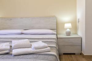 Posteľ alebo postele v izbe v ubytovaní Vico Rooms