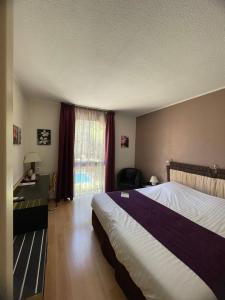 Postel nebo postele na pokoji v ubytování Le Clos De L'aube Rouge - Montpellier / Castelnau le Lez