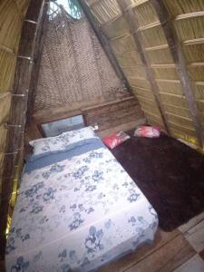 an overhead view of a bed in a tent at Camping Redario Manauara in Alter do Chao