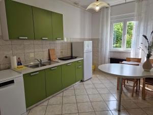 Kuchyň nebo kuchyňský kout v ubytování Lavanda Apartment