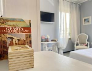 a book sitting on top of a table in a room at CasaViva - Le Vele di Angela in Genoa