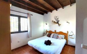 Łóżko lub łóżka w pokoju w obiekcie Casa Nisamarita by Sea You There Fuerteventura