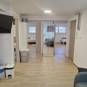 a hallway with a living room and a dining room at Apartman Maksimirska 89 Zagreb in Zagreb