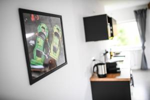 a picture of a pair of skis hanging on a wall at Appartments Zweite Heimat Nürburg in Reimerath