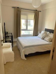 a bedroom with a large bed and a window at Caesar resort & SPA, Claudius 2 bedroom apartment, Iskele, Long beach in Saint Yeorgios +14 photos