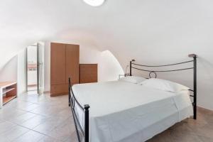 מיטה או מיטות בחדר ב-Casa Margherita