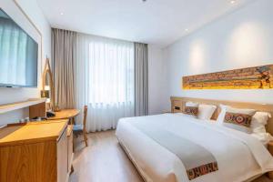 Yoba Boutique Hotel客房内的一张或多张床位