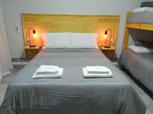 a bedroom with a bed with two towels on it at Concilio I in San Javier
