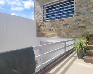 a balcony with a bench and a building at Villa dream in Casablanca