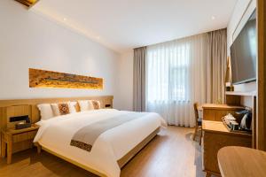 Yoba Boutique Hotel客房内的一张或多张床位