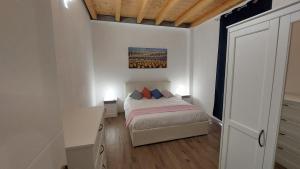 Ένα ή περισσότερα κρεβάτια σε δωμάτιο στο VIgarani Apartments