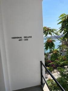 a view of the ocean from the balcony of a building at Kanes Boutique Hotel in Sarandë