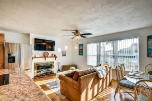 a living room with a couch and a table at Ormond Beach Home: Walk to Community Beach! in Ormond Beach