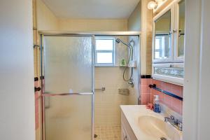 a bathroom with a shower and a sink at Ormond Beach Home: Walk to Community Beach! in Ormond Beach +16 photos