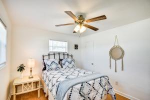 a bedroom with a bed and a ceiling fan at Ormond Beach Home: Walk to Community Beach! in Ormond Beach