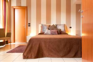 Voodi või voodid majutusasutuse Agorà Hotel toas