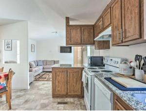 a kitchen with wooden cabinets and white appliances at Blue Mountainview in Mariposa